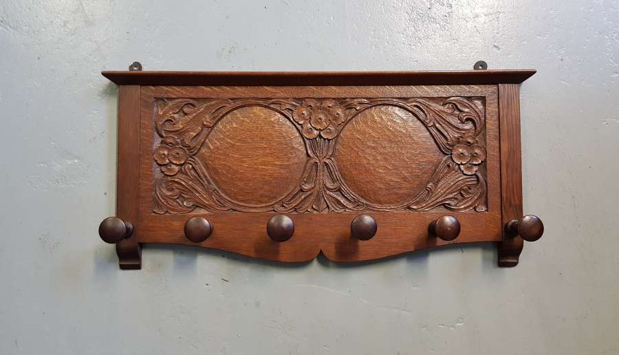 Arthur Simpson of Kendal Arts & Crafts carved pegged coat rack