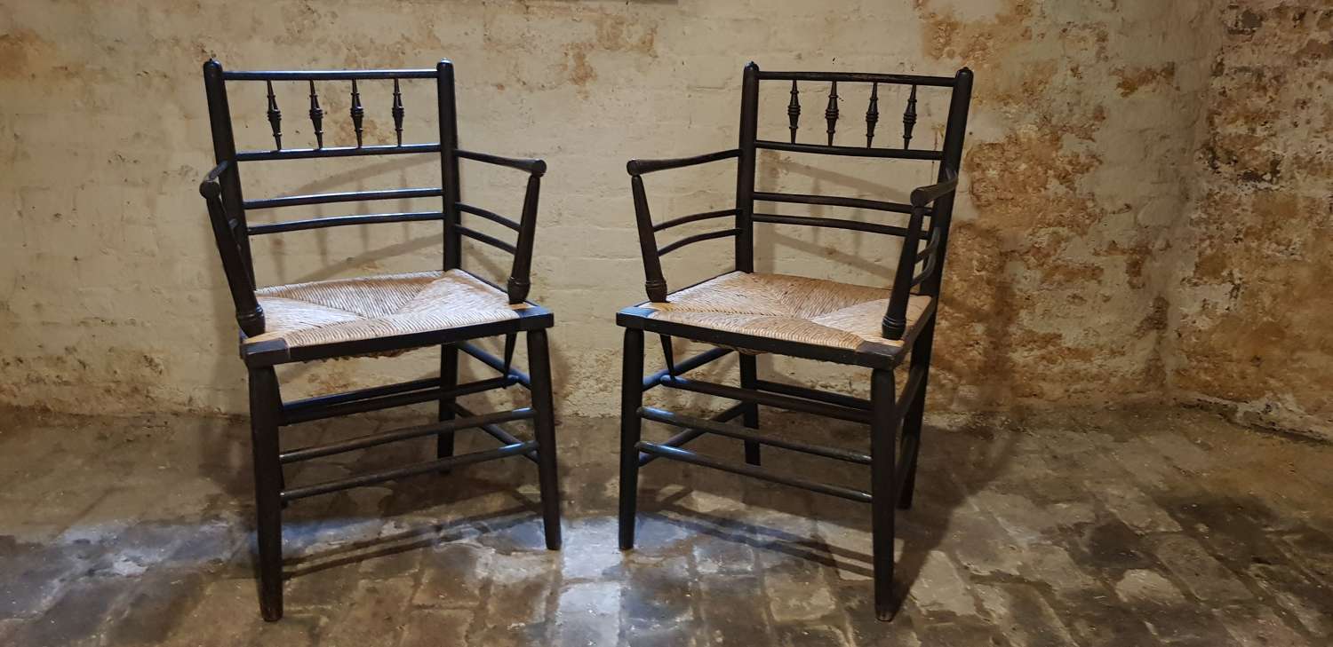 Pair of Morris & Co Arts & Crafts rushed seated Sussex armchairs