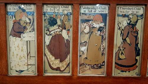 Oak Arts & Crafts Liberty style 7 days of the week nursery prints over mantle