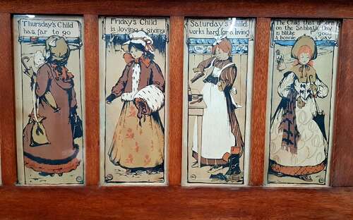 Oak Arts & Crafts Liberty style 7 days of the week nursery prints over mantle