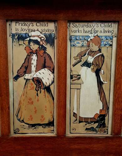 Oak Arts & Crafts Liberty style 7 days of the week nursery prints over mantle